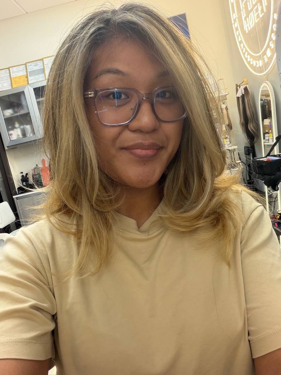 Soft blonde face framing by Olena at Blond Transformation